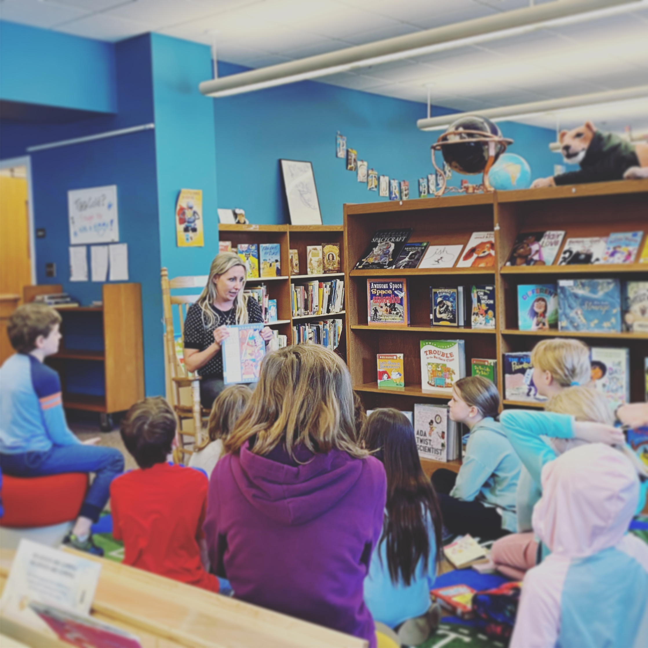 Stephanie reading to children at local school