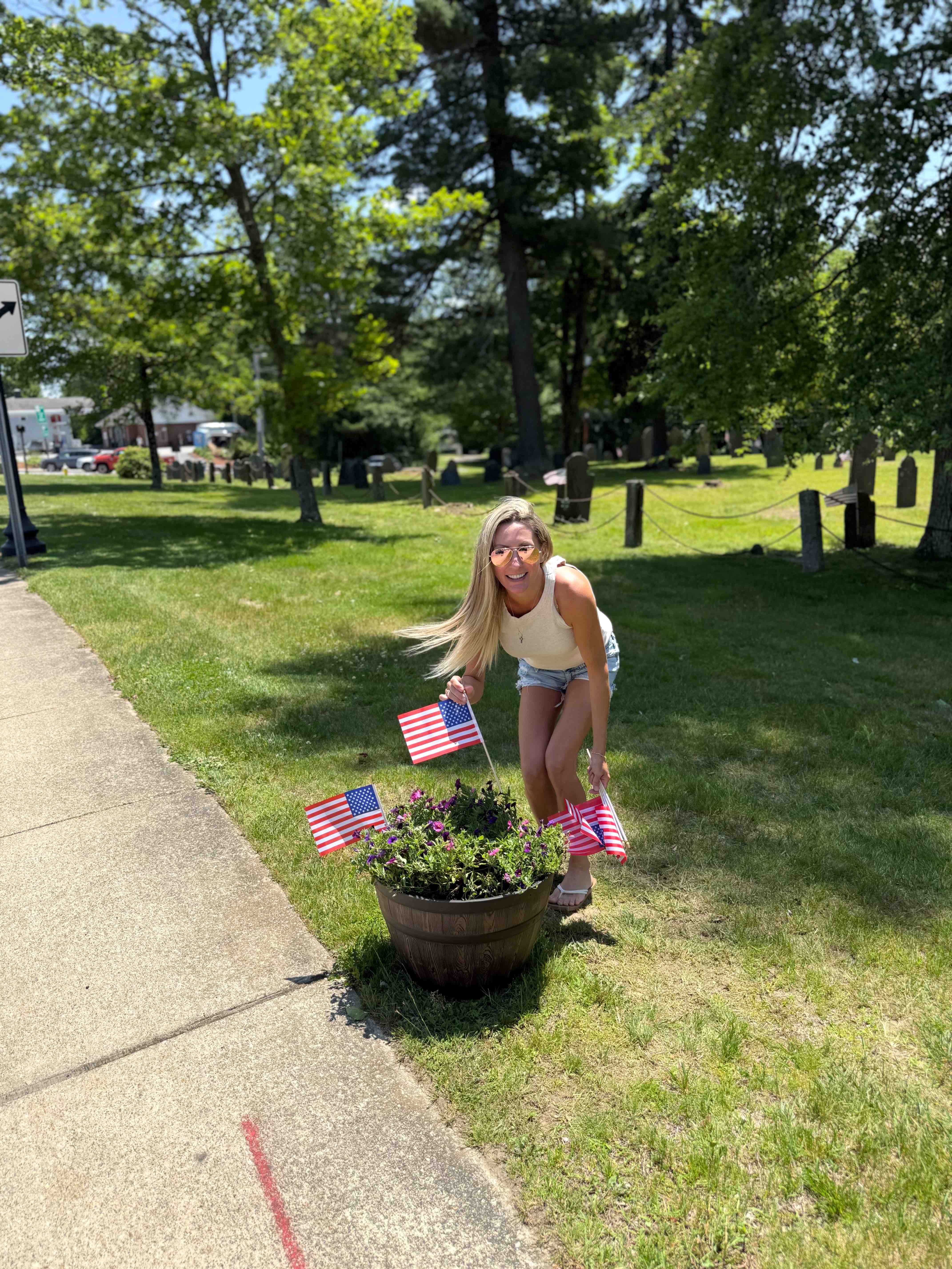 Stephanie Mulroy planting flowers in downtown Holden