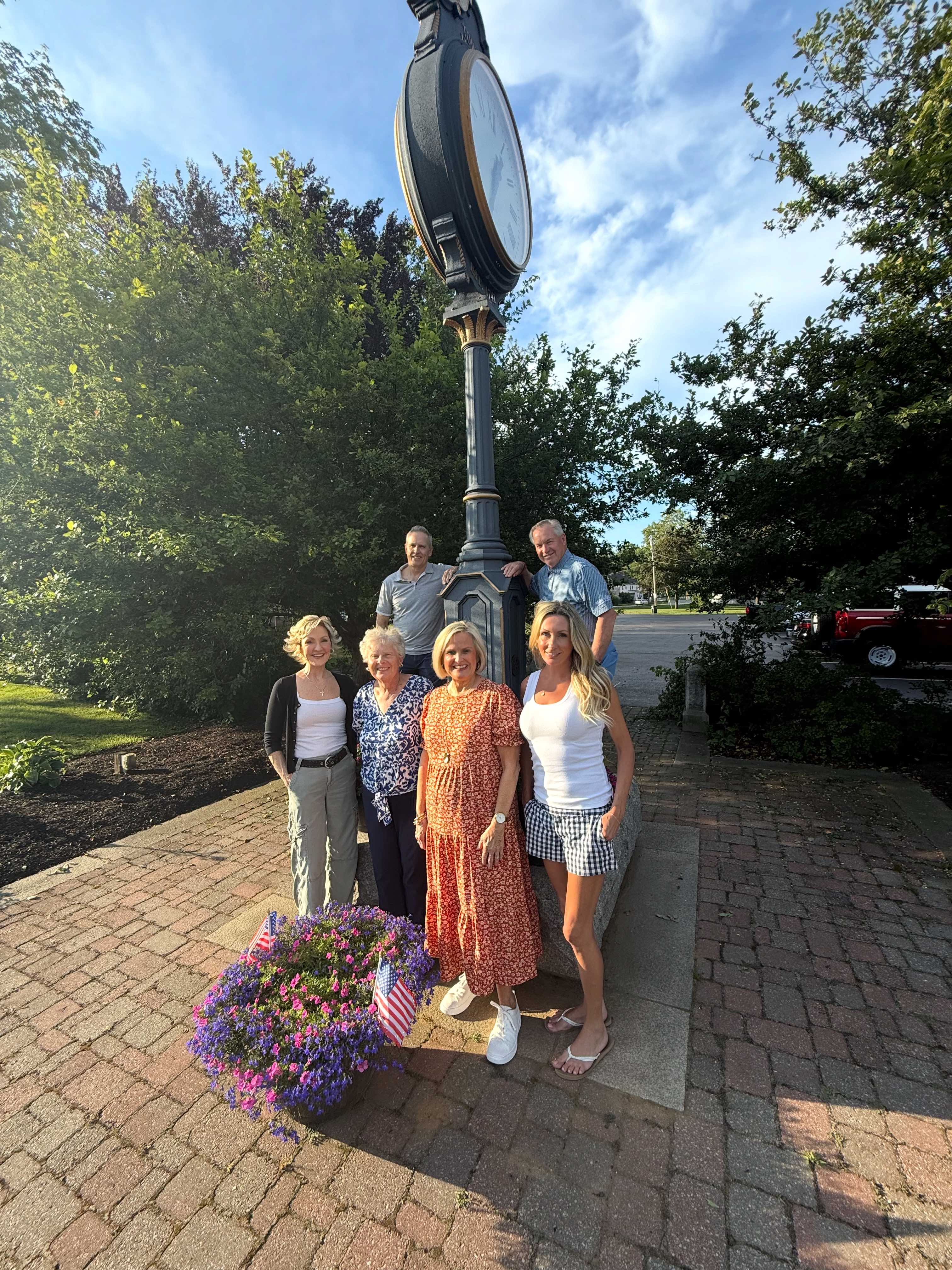 Stephanie Mulroy and volunteers at the Holden clock tower with flower planters